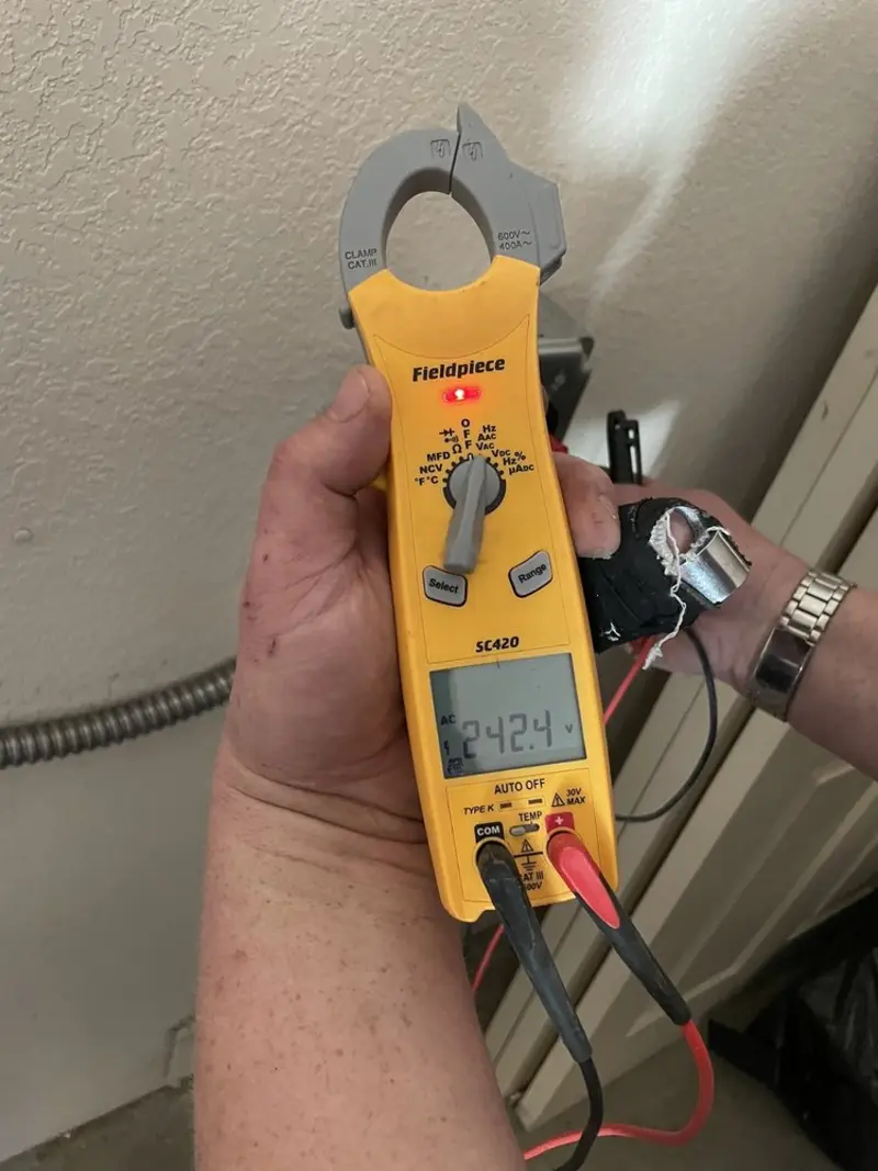Voltage testing with clamp meter during Electrical Installation Services in Minneola